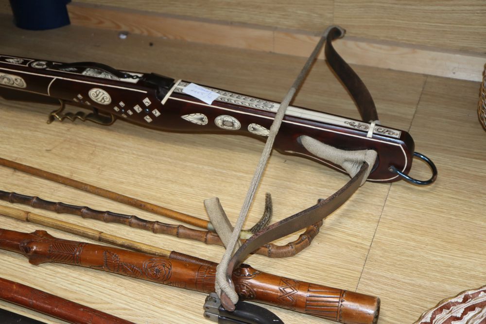 A European bone inlaid crossbow, two walking canes and three riding crops